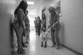 Hillary dancing with little girl